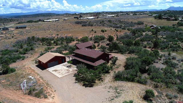 drone / aerial view featuring a mountain view