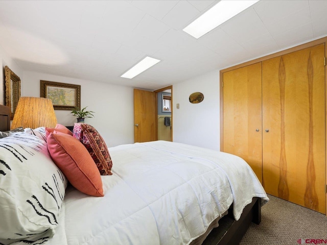 bedroom with carpet floors and a closet