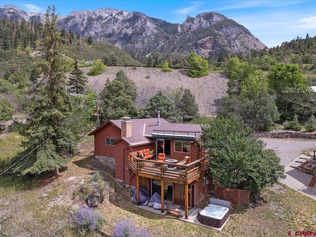 birds eye view of property with a mountain view