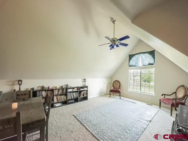 bonus room with carpet, lofted ceiling, and ceiling fan