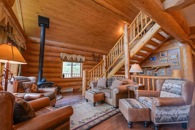 living room featuring rustic walls, wood-type flooring, a wood stove, and lofted ceiling