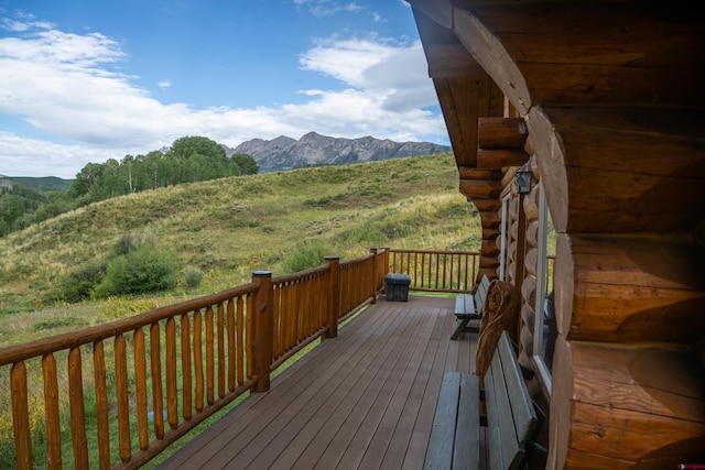 wooden deck featuring a mountain view