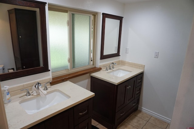 bathroom featuring tile patterned flooring and double vanity