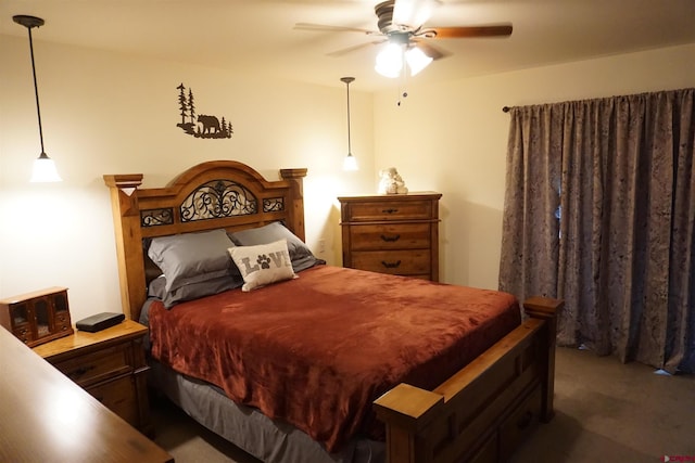 bedroom featuring ceiling fan and dark colored carpet