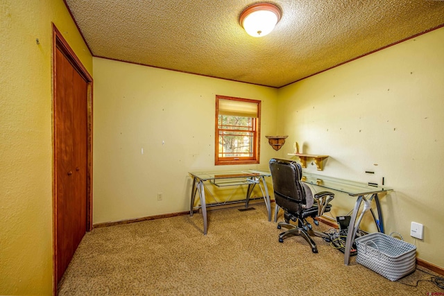 carpeted home office with a textured ceiling