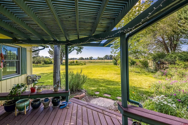 deck featuring a yard and a rural view