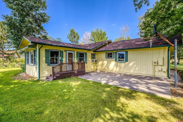 ranch-style house with cooling unit, a patio area, and a front lawn