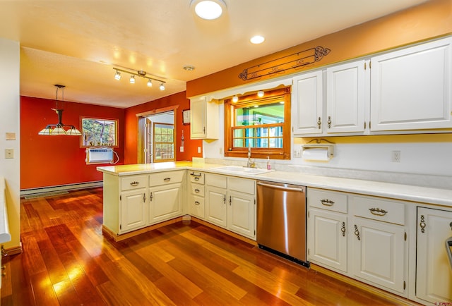 kitchen featuring a wealth of natural light, a baseboard radiator, stainless steel dishwasher, and decorative light fixtures