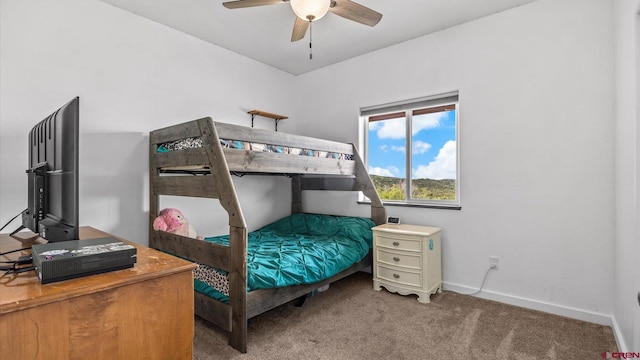 bedroom featuring ceiling fan and carpet