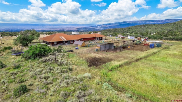 birds eye view of property featuring a rural view and a mountain view