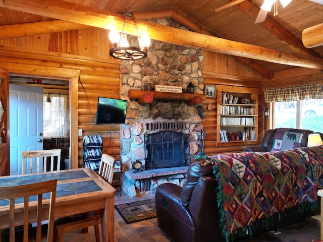 living room featuring vaulted ceiling with beams, a stone fireplace, ceiling fan with notable chandelier, log walls, and wooden ceiling