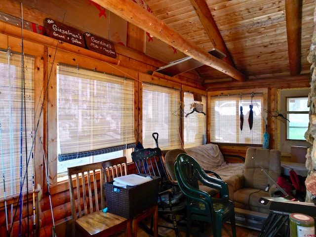 interior space featuring vaulted ceiling with beams and wooden ceiling