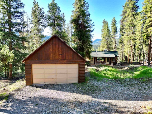 view of front of property with an outbuilding and a garage