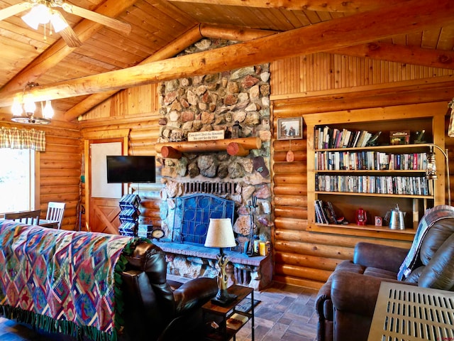 living room with vaulted ceiling with beams, rustic walls, ceiling fan, wooden ceiling, and a stone fireplace