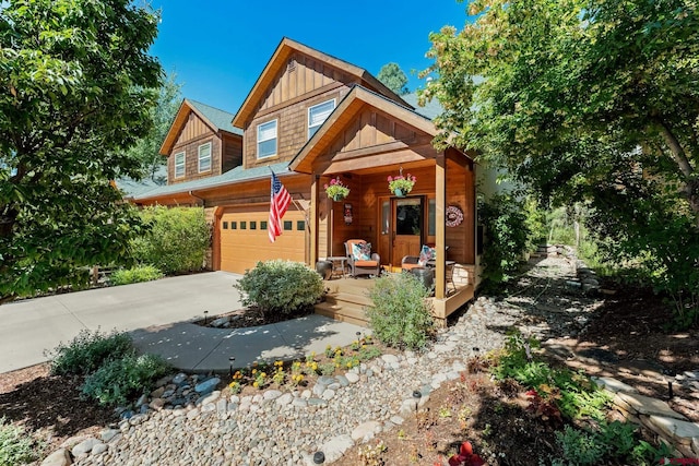 view of front of house featuring covered porch and a garage