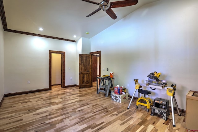 interior space featuring baseboards, a ceiling fan, crown molding, light wood-type flooring, and recessed lighting