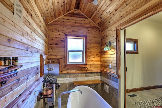 full bathroom with lofted ceiling, a soaking tub, wooden ceiling, and wooden walls