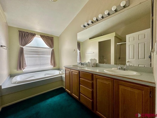 bathroom with independent shower and bath, vanity, and lofted ceiling