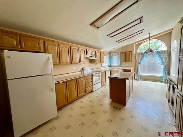 kitchen featuring vaulted ceiling, sink, a center island, light tile patterned flooring, and white appliances