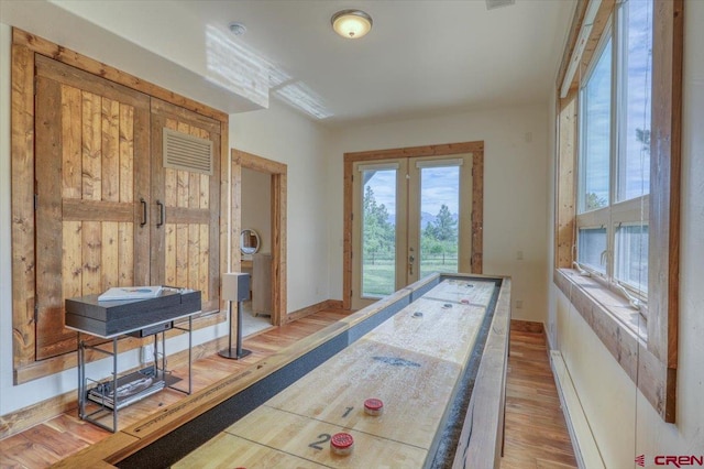 interior space featuring hardwood / wood-style flooring and french doors