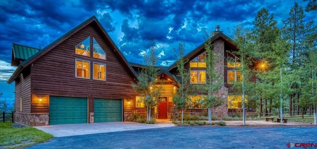 rear view of property with a garage