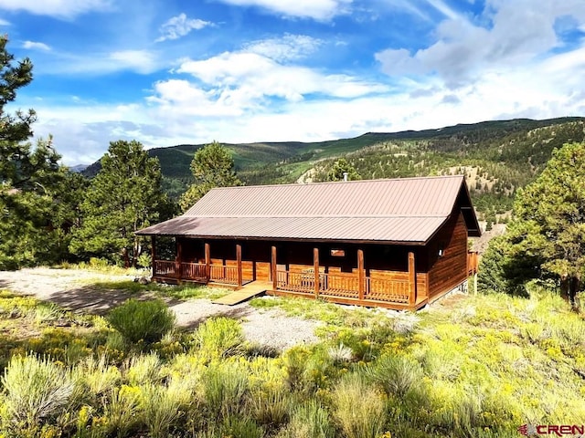 view of stable featuring a mountain view