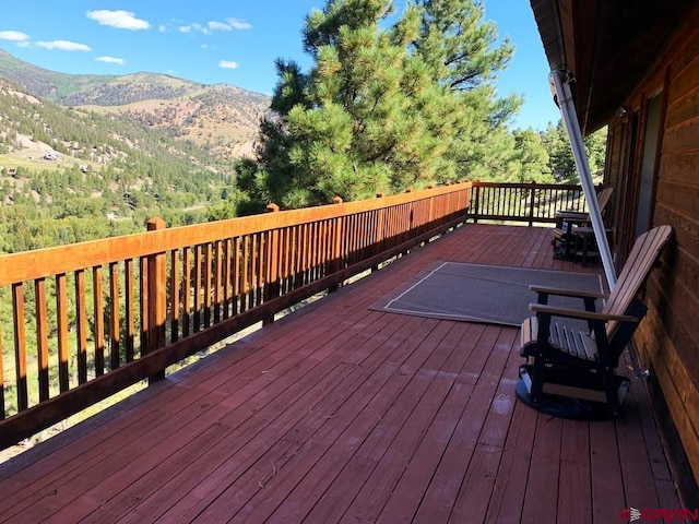 wooden terrace with a mountain view