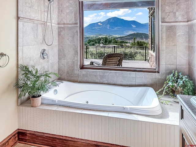 bathroom featuring plus walk in shower and a mountain view