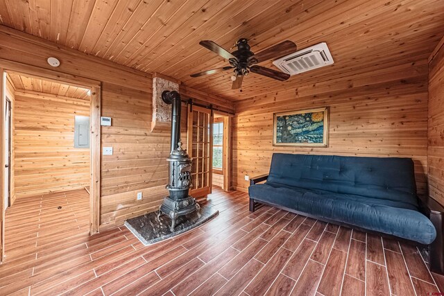 unfurnished room with wood ceiling, hardwood / wood-style flooring, and wood walls