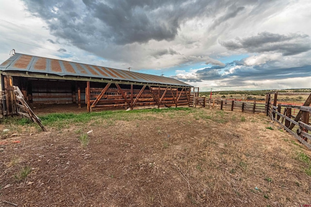 view of outbuilding with a rural view