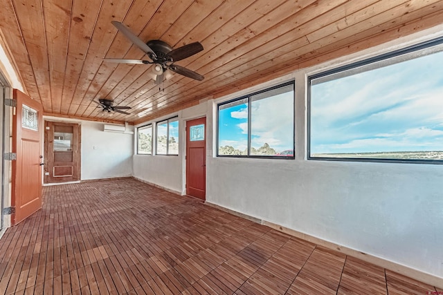 interior space with ceiling fan and wooden ceiling