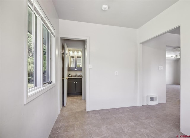 empty room featuring a sink and visible vents