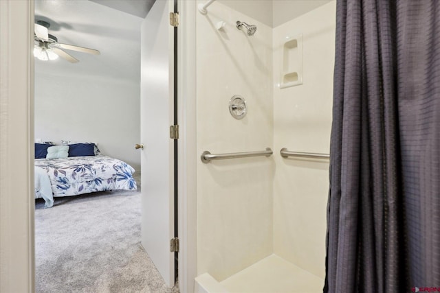 ensuite bathroom featuring ceiling fan, a shower stall, and ensuite bath