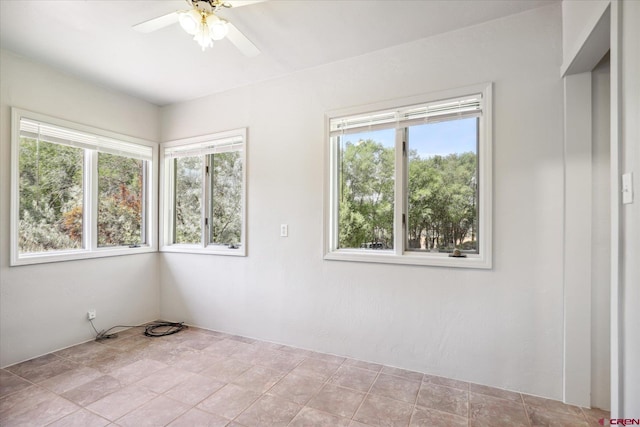 unfurnished room with a ceiling fan