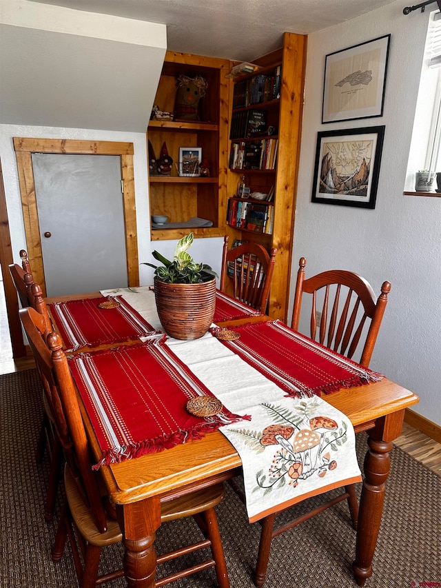 dining area with carpet