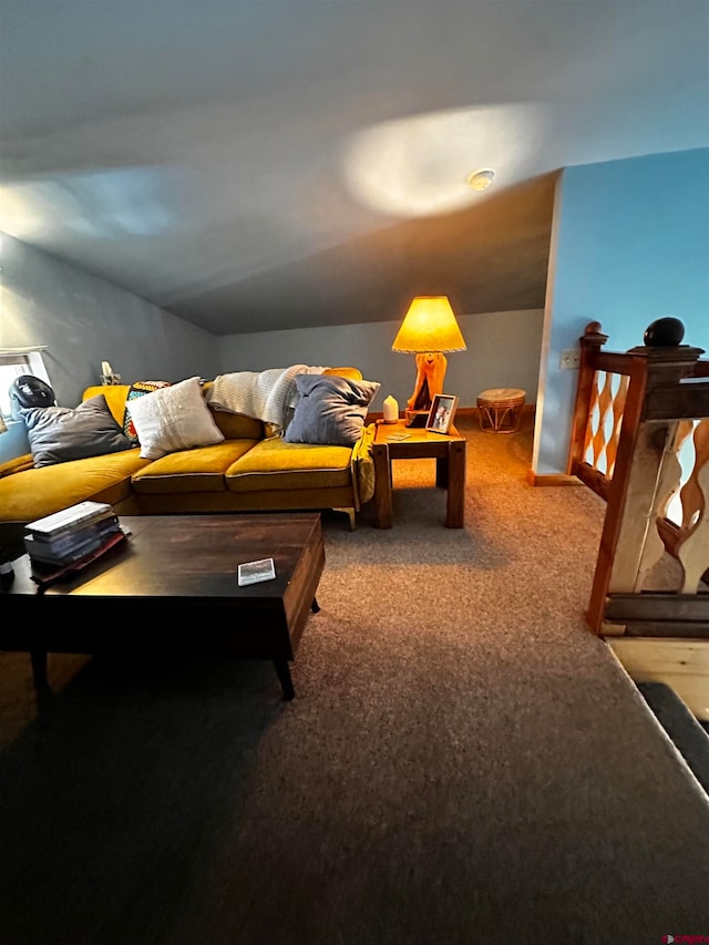 living room featuring vaulted ceiling and carpet floors