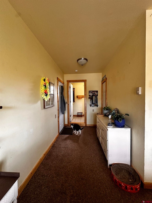 corridor with carpet flooring