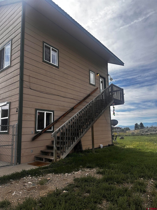 view of side of home featuring a lawn