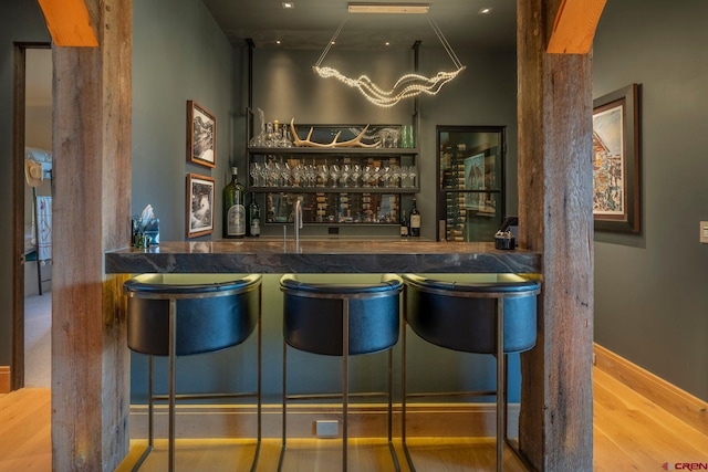 bar featuring hardwood / wood-style flooring