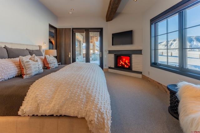 1251 Skyland Dr, Crested Butte, CO 81224 - bedroom with carpet, baseboards, beamed ceiling, access to outside, and a warm lit fireplace