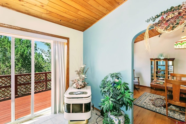 interior space with lofted ceiling, hardwood / wood-style floors, and wood ceiling