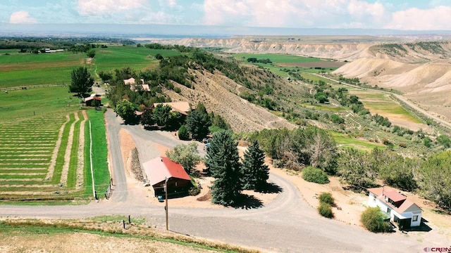 birds eye view of property with a rural view