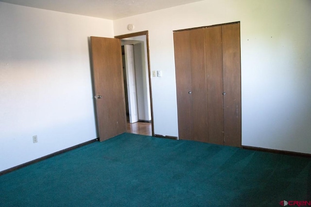 unfurnished bedroom with a closet and carpet flooring