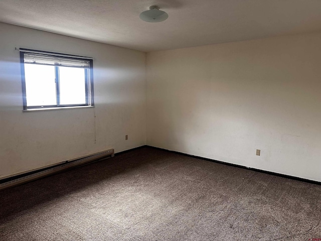 304 N 9th St Unit 5A, Gunnison, CO 81230 - carpeted spare room with a baseboard radiator and baseboards