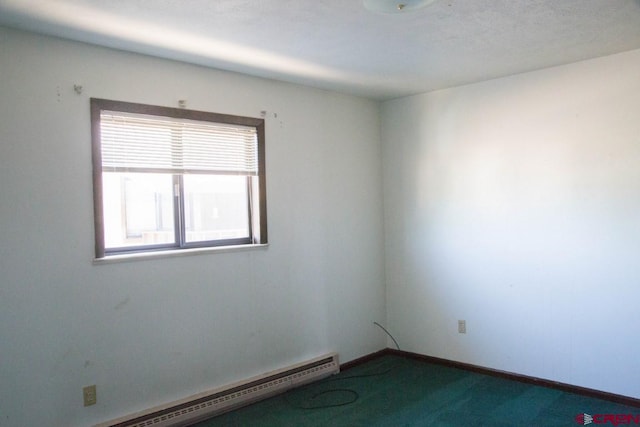 empty room with carpet flooring and baseboard heating