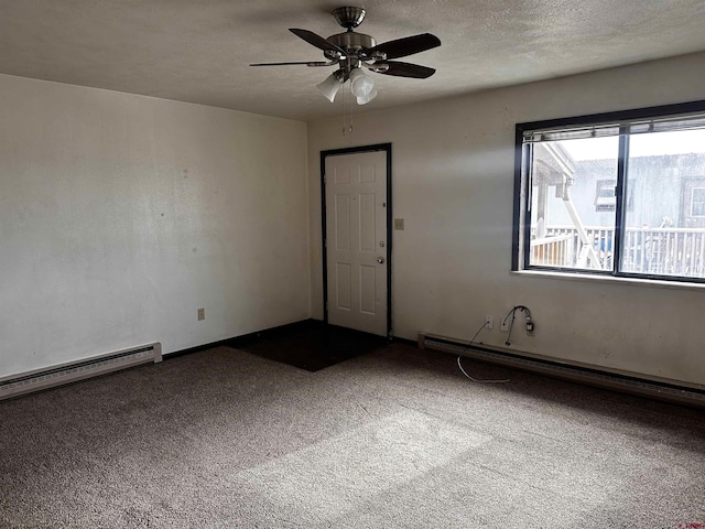 304 N 9th St Unit 5A, Gunnison, CO 81230 - carpeted spare room featuring a baseboard radiator, ceiling fan, and a textured ceiling