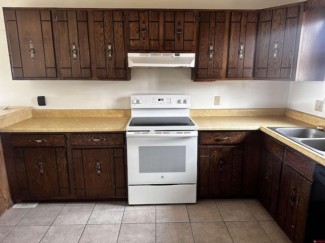304 N 9th St Unit 5A, Gunnison, CO 81230 - kitchen with light tile patterned floors, under cabinet range hood, dishwasher, a sink, and white electric stove