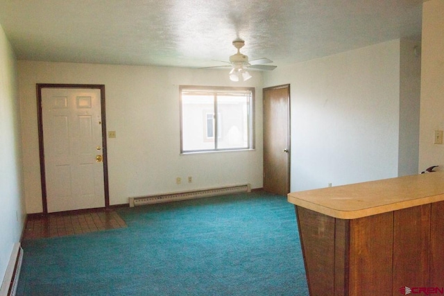 unfurnished living room featuring ceiling fan, baseboard heating, and dark carpet