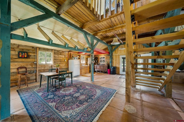 interior space with wooden ceiling and vaulted ceiling with beams