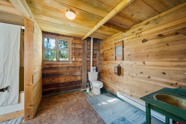 interior space featuring wood ceiling, toilet, and wooden walls